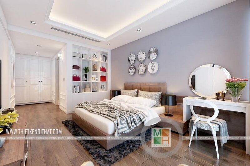 Thiết kế nội thất phòng ngủ hiện đại cho cặp vợ chồng trẻ với đồ nội thất gỗ công nghiệp cao cấp màu trắng: giường ngủ bọc nệm, bàn trang điểm, kệ tủ trưng bày, ..